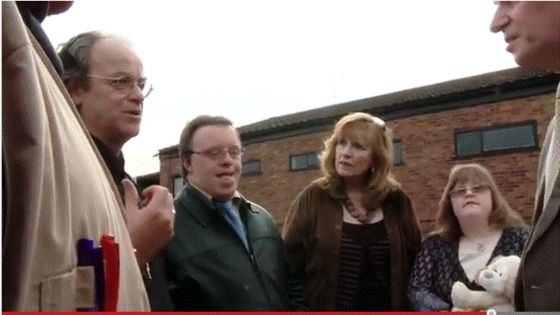 Northampton, England, June 6, 2010 Kevin Annett (left) speaks to UK police about the location of Church-State ritual torture of disabled children;  victim Holly Grieg is on the right with her mother